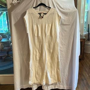 Cream colored sweater dress. Patterned